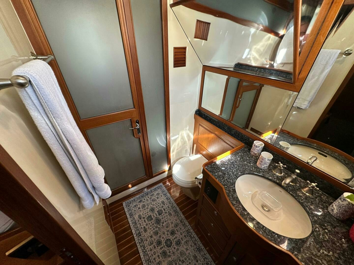 a bathroom with a sink and a mirror aboard MISS STEPHANIE  Yacht for Sale