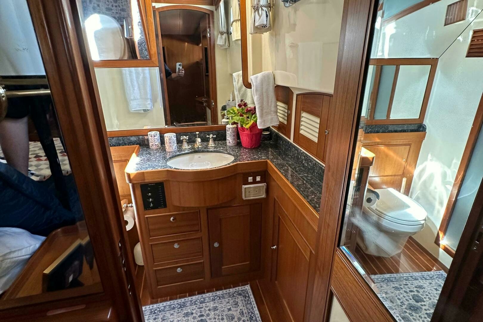 a bathroom with a sink and a mirror aboard MISS STEPHANIE  Yacht for Sale