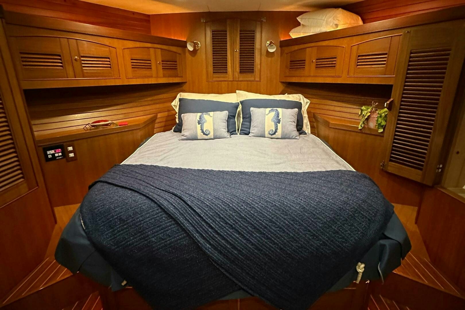 a bed in a room aboard MISS STEPHANIE  Yacht for Sale