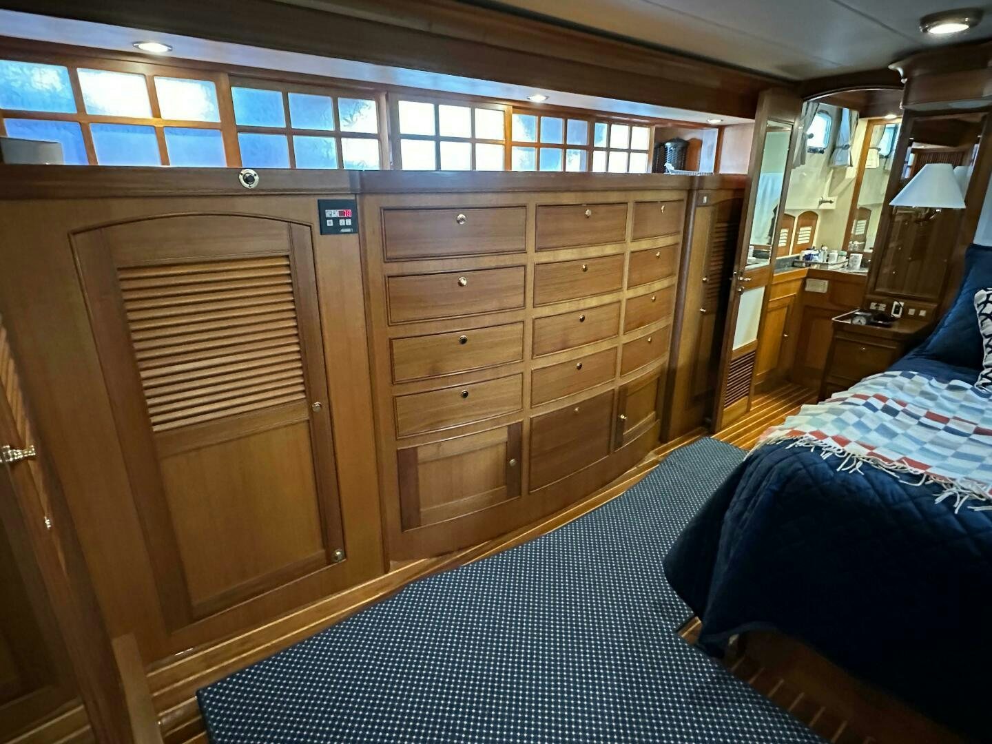 a room with a bed and a dresser aboard MISS STEPHANIE  Yacht for Sale