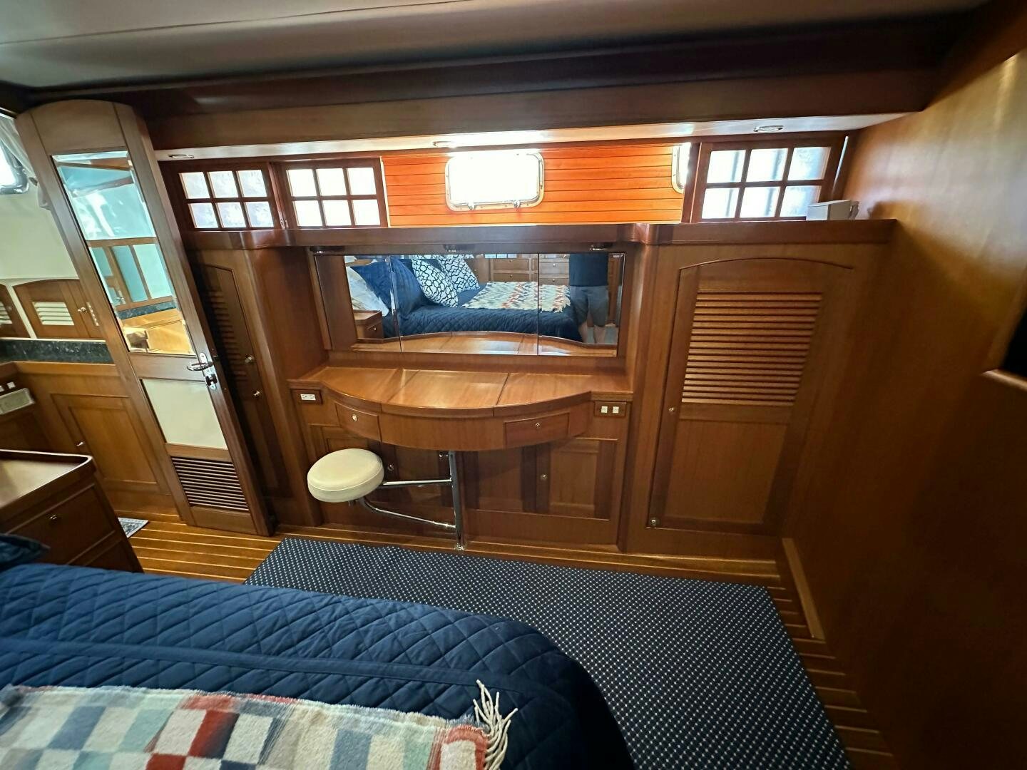 a room with a bed and a table aboard MISS STEPHANIE  Yacht for Sale