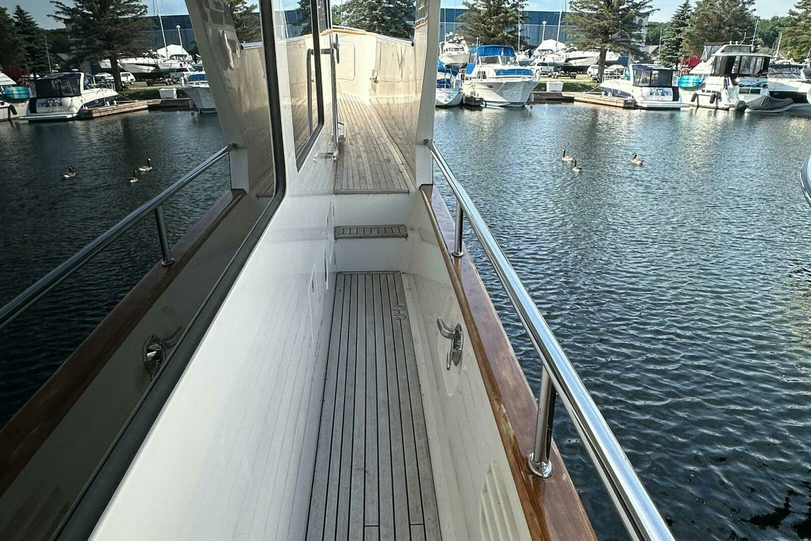 a long dock with boats aboard MISS STEPHANIE  Yacht for Sale