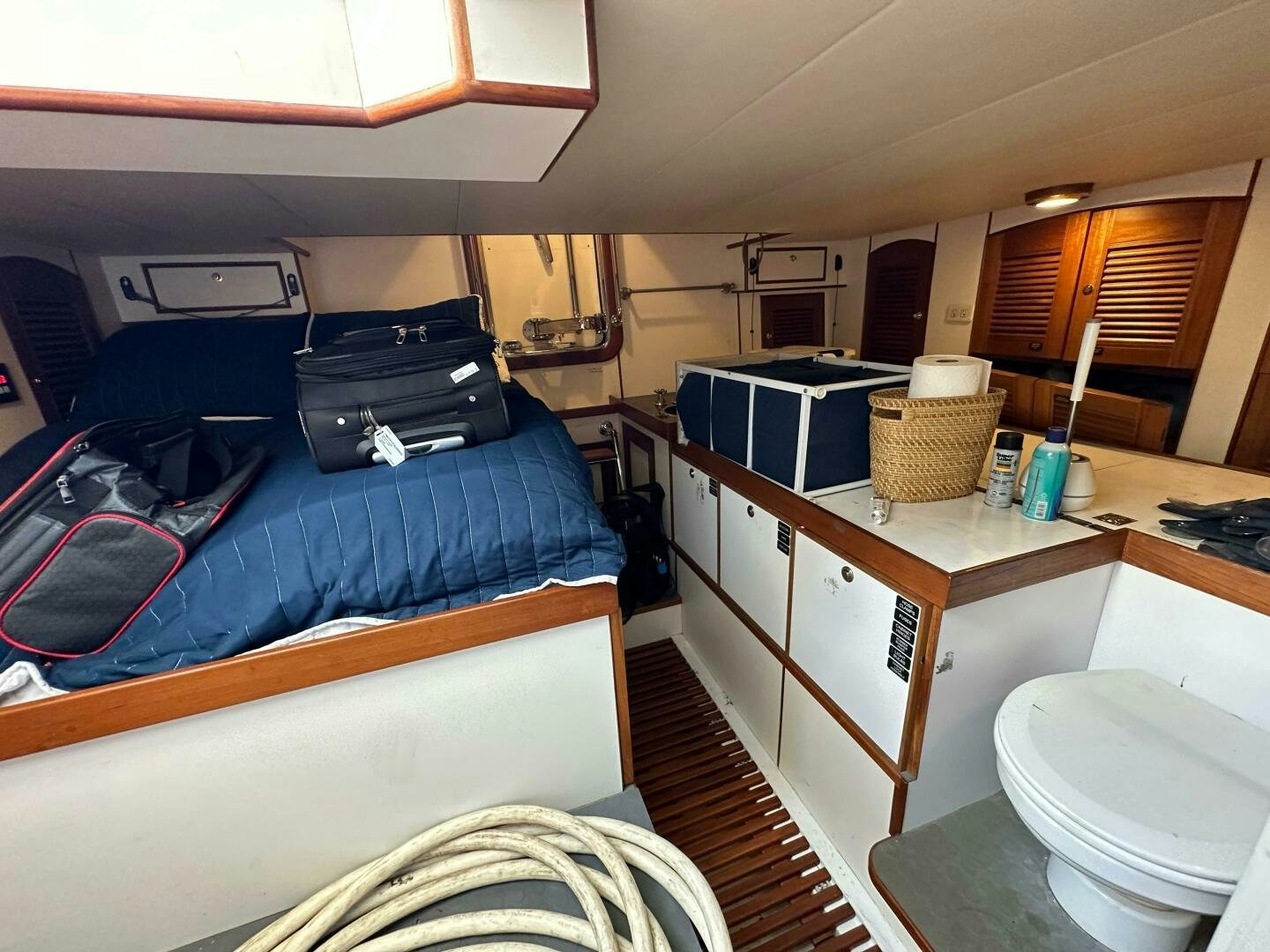 a room with bunk beds and a desk aboard MISS STEPHANIE  Yacht for Sale