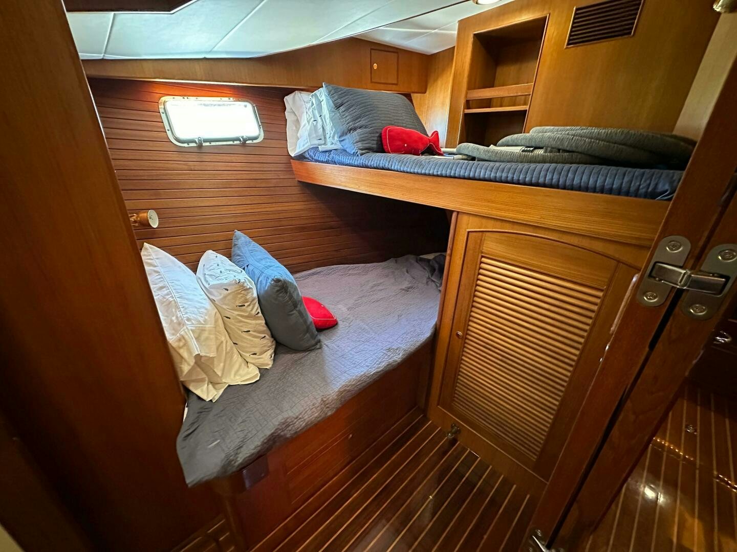 a bed with clothes on it aboard MISS STEPHANIE  Yacht for Sale