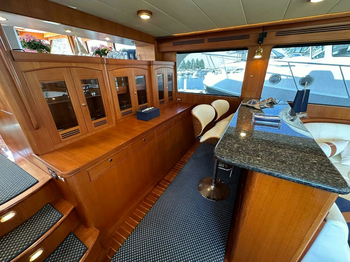a room with a table and chairs aboard MISS STEPHANIE  Yacht for Sale