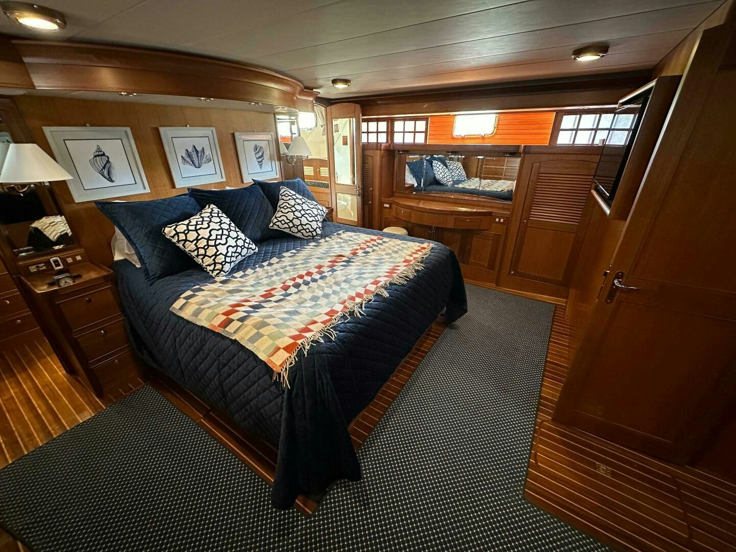 a bedroom with a bed and a desk aboard MISS STEPHANIE  Yacht for Sale