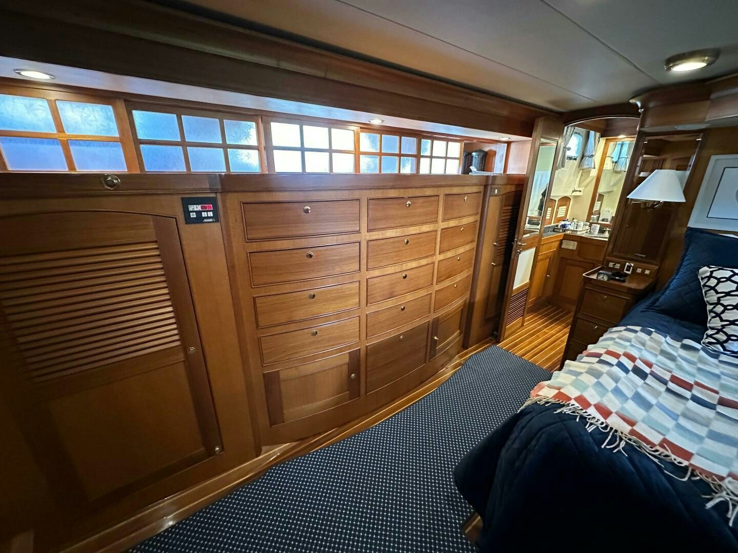 a room with a bed and a dresser aboard MISS STEPHANIE  Yacht for Sale
