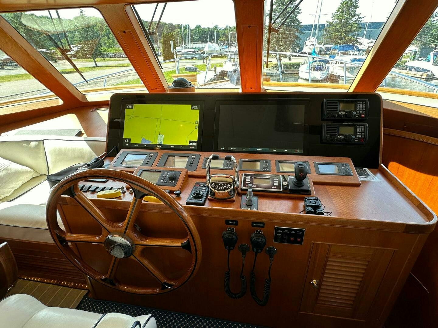 a wooden table with a computer and other electronics on it aboard MISS STEPHANIE  Yacht for Sale