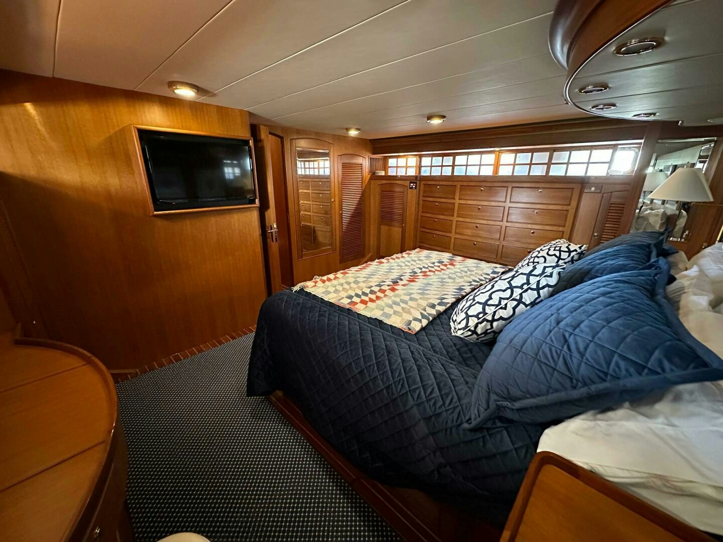 a room with a bed and a television aboard MISS STEPHANIE  Yacht for Sale