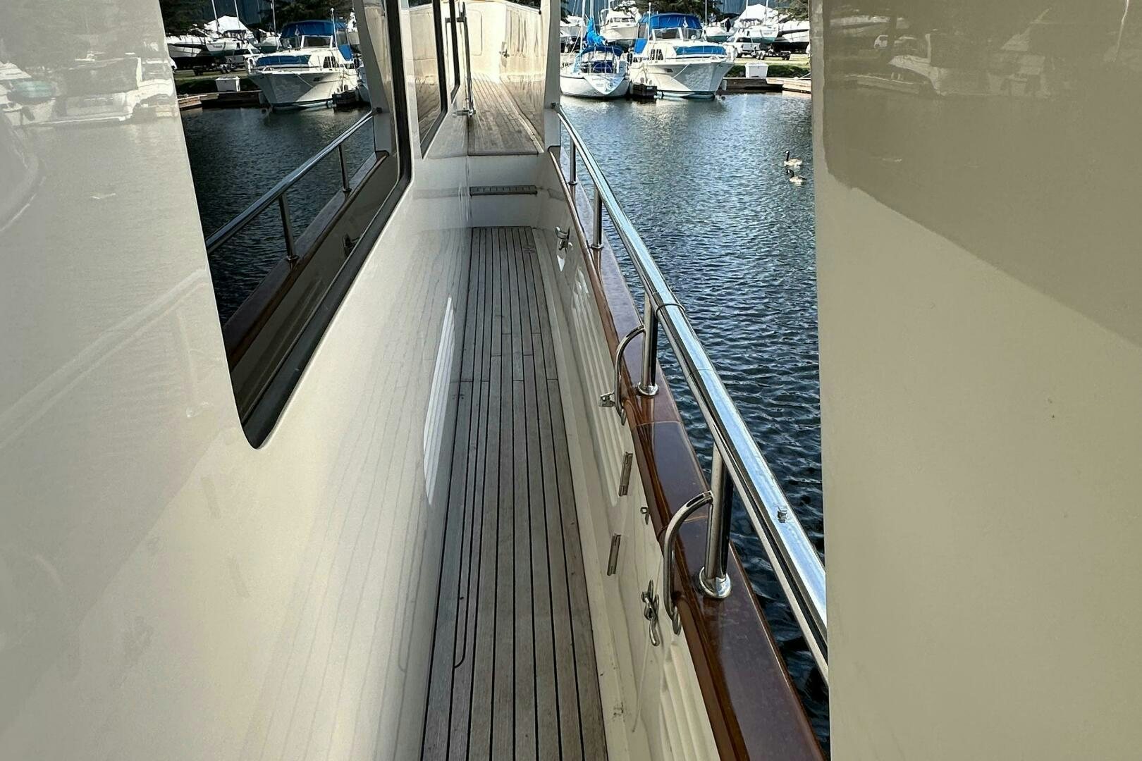 a long dock with boats aboard MISS STEPHANIE  Yacht for Sale