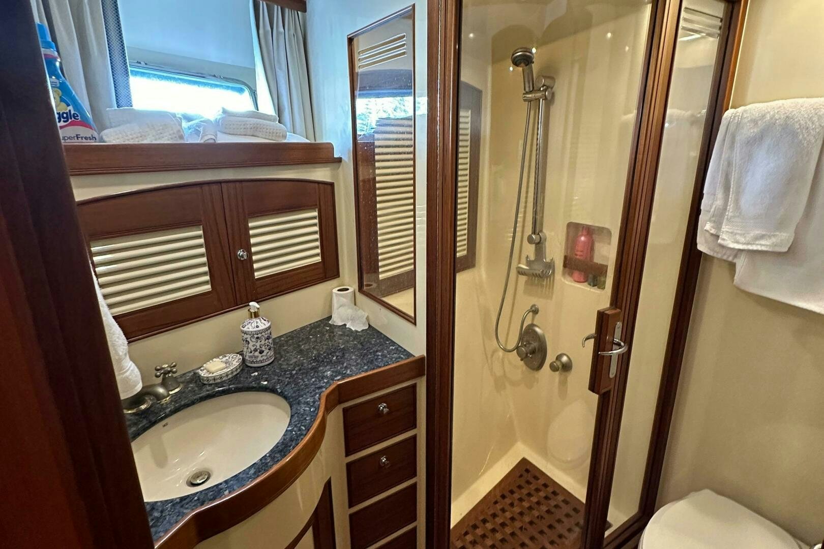 a bathroom with a sink and a shower aboard MISS STEPHANIE  Yacht for Sale