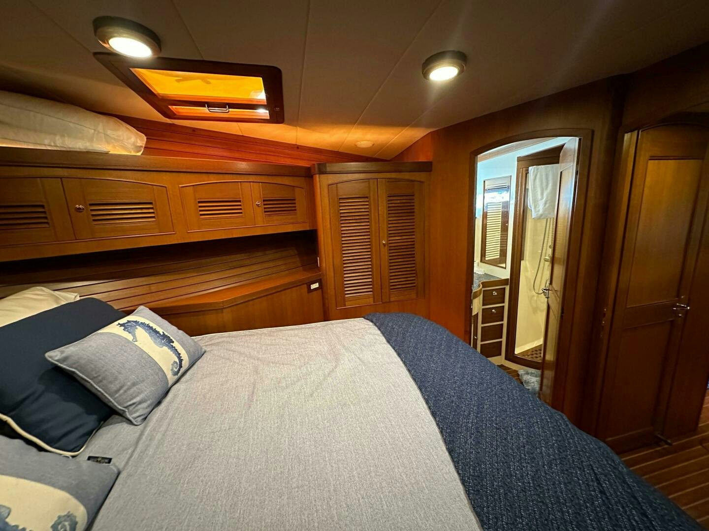 a bed in a room aboard MISS STEPHANIE  Yacht for Sale
