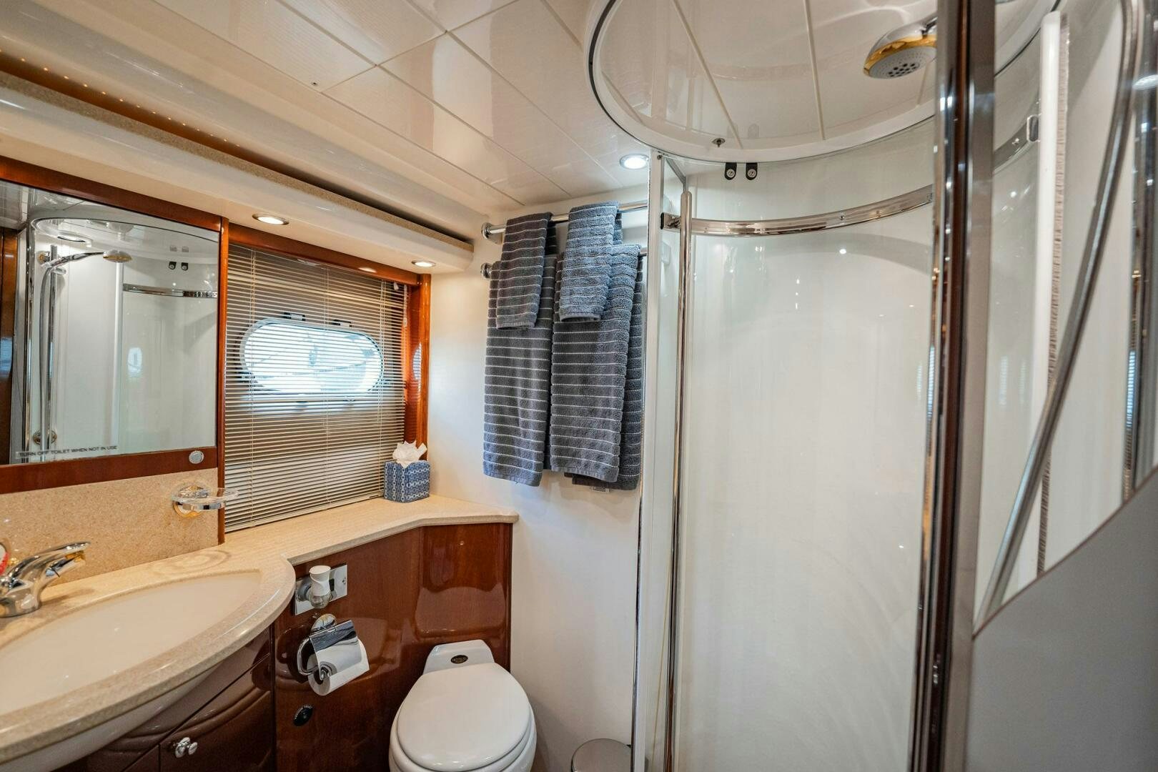 a bathroom with a sink and a mirror aboard HALF MINE Yacht for Sale