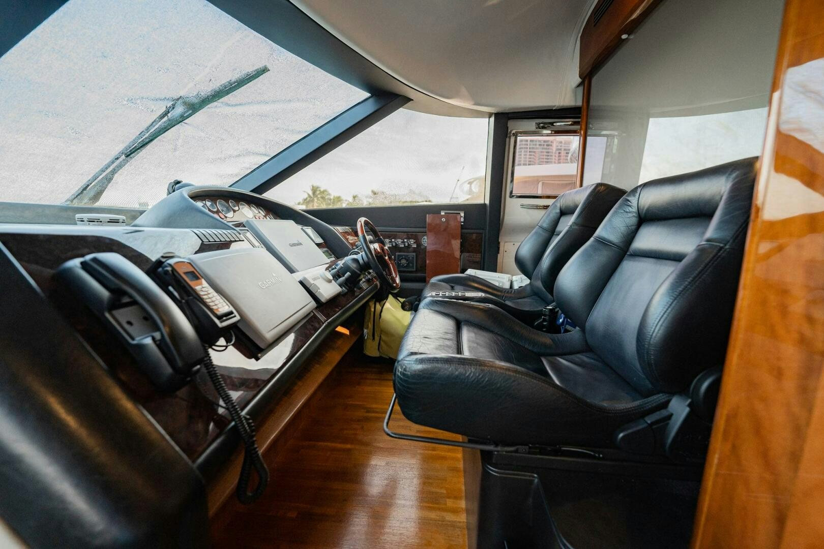 a room with a chair and luggage aboard HALF MINE Yacht for Sale