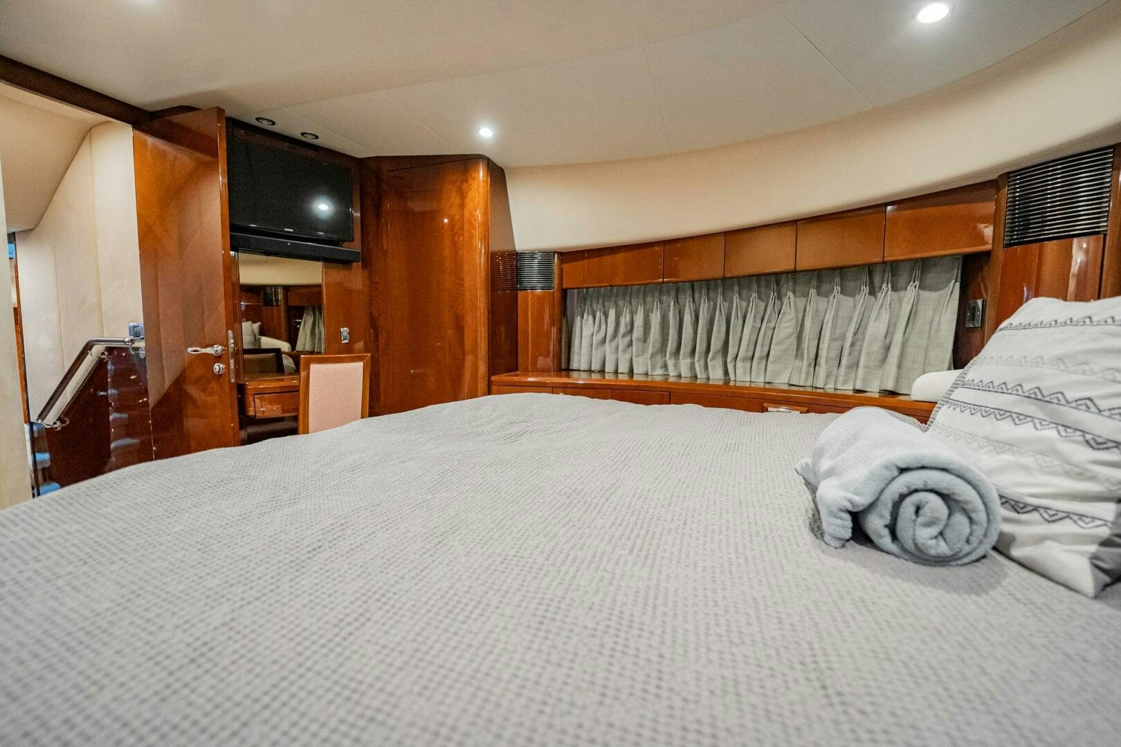 a bed with white sheets aboard HALF MINE Yacht for Sale