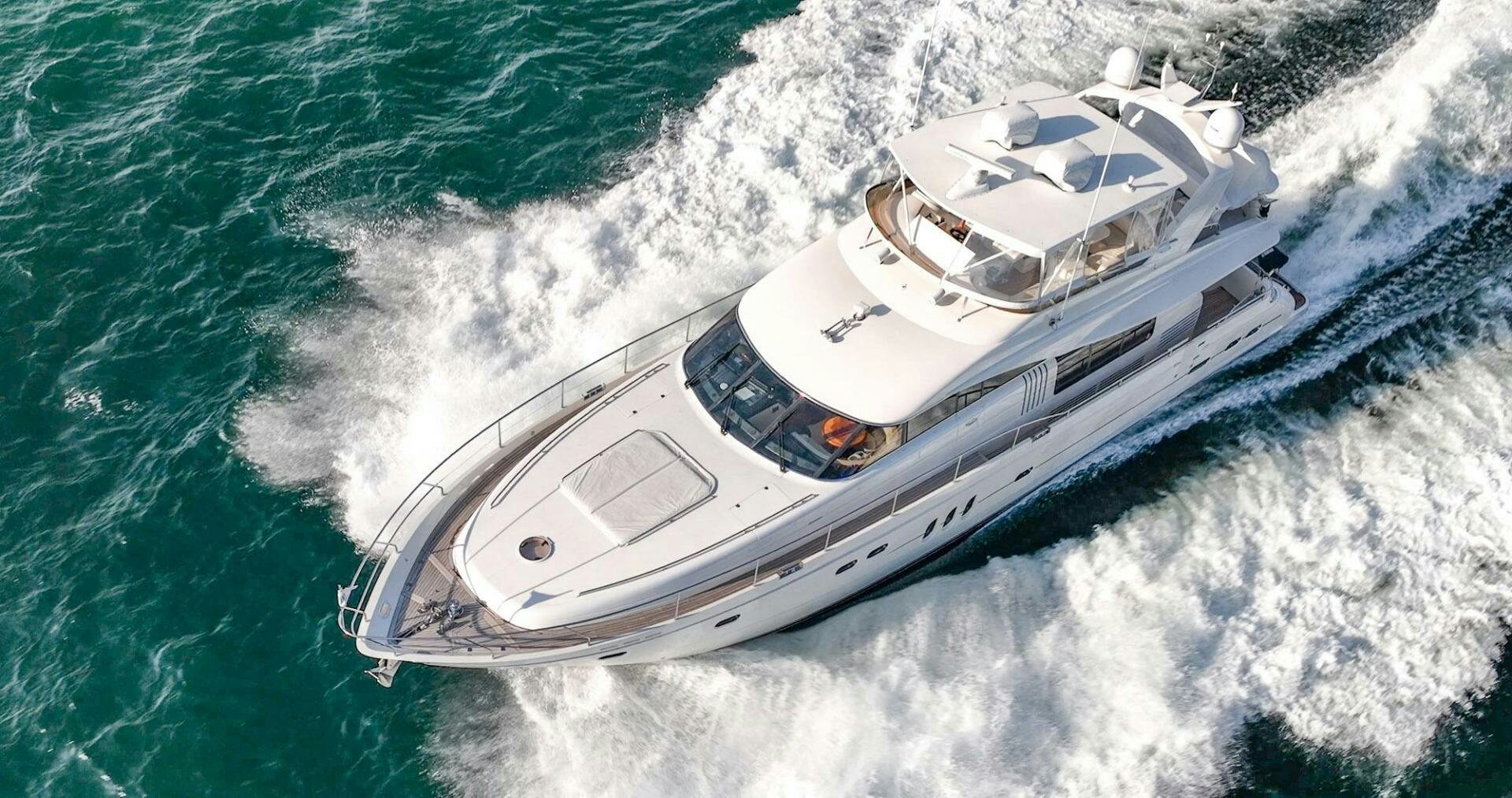 a white boat on the water aboard HALF MINE Yacht for Sale