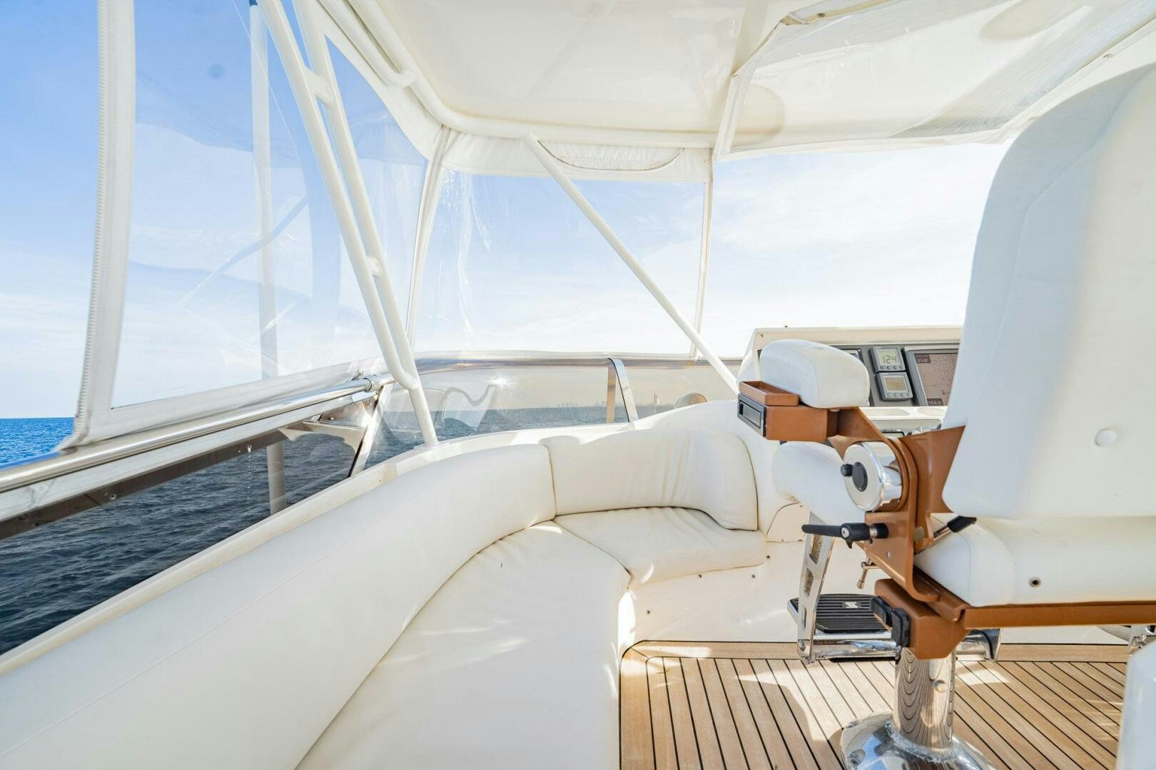 a person in a white suit in a white room aboard HALF MINE Yacht for Sale
