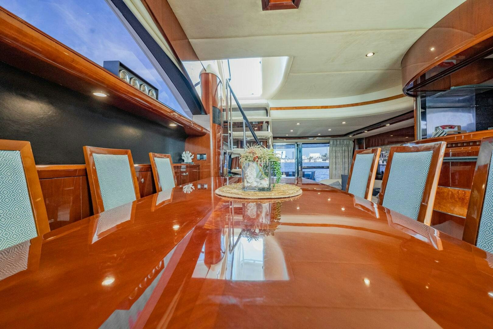 a room with wooden tables and chairs aboard HALF MINE Yacht for Sale