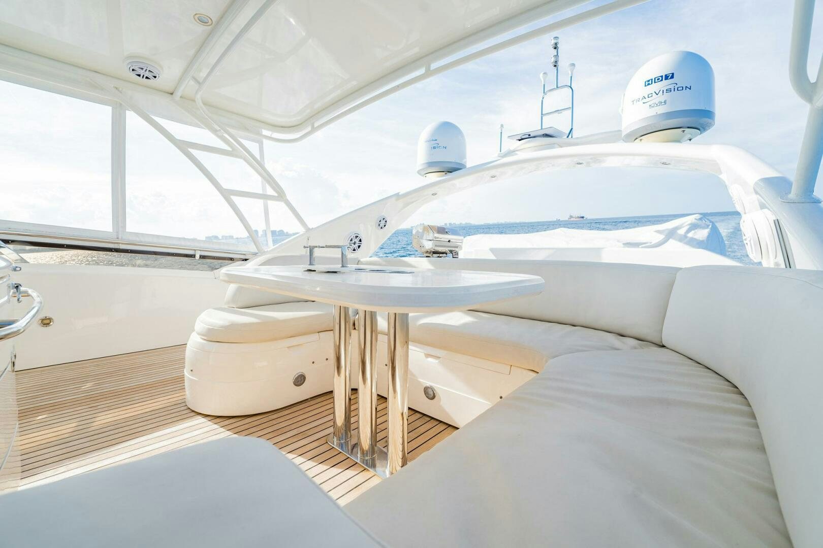 a white boat with a white cover aboard HALF MINE Yacht for Sale