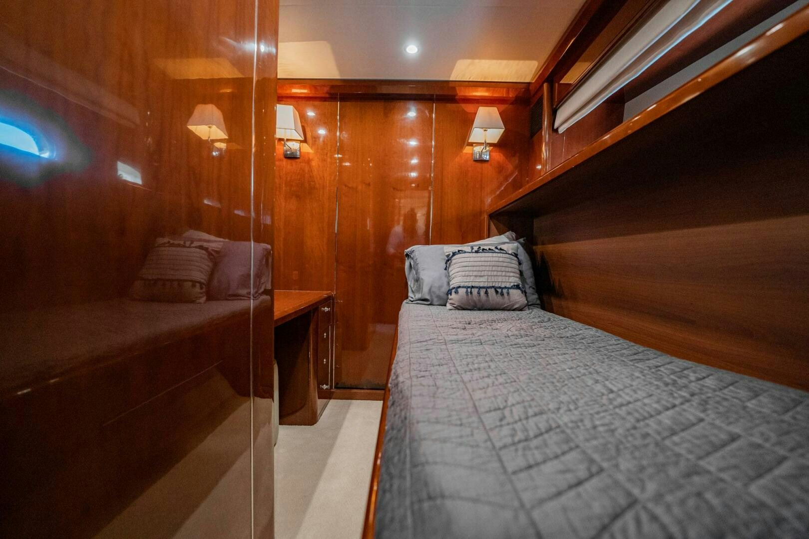 a room with a bed and a wood wall aboard HALF MINE Yacht for Sale
