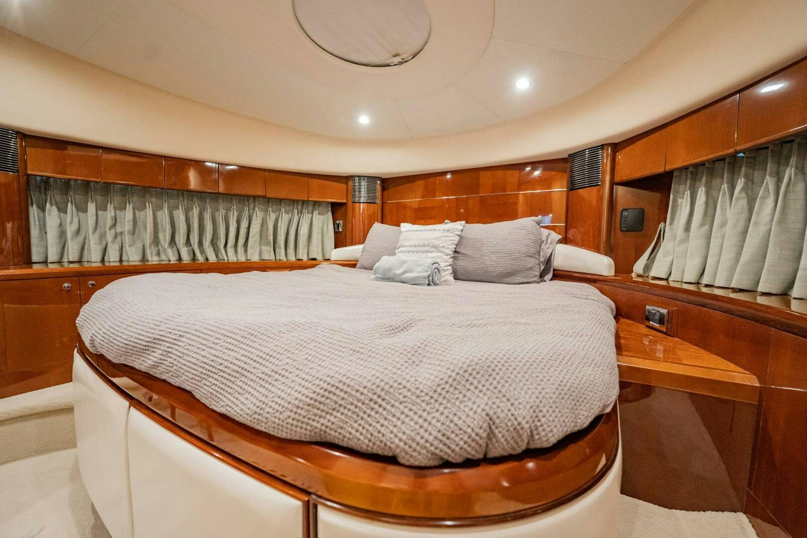 a bed with a white sheet and pillows aboard HALF MINE Yacht for Sale