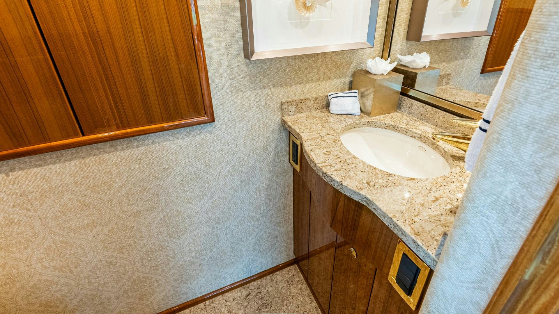 a bathroom with a sink and a mirror aboard BLUE EYES Yacht for Sale