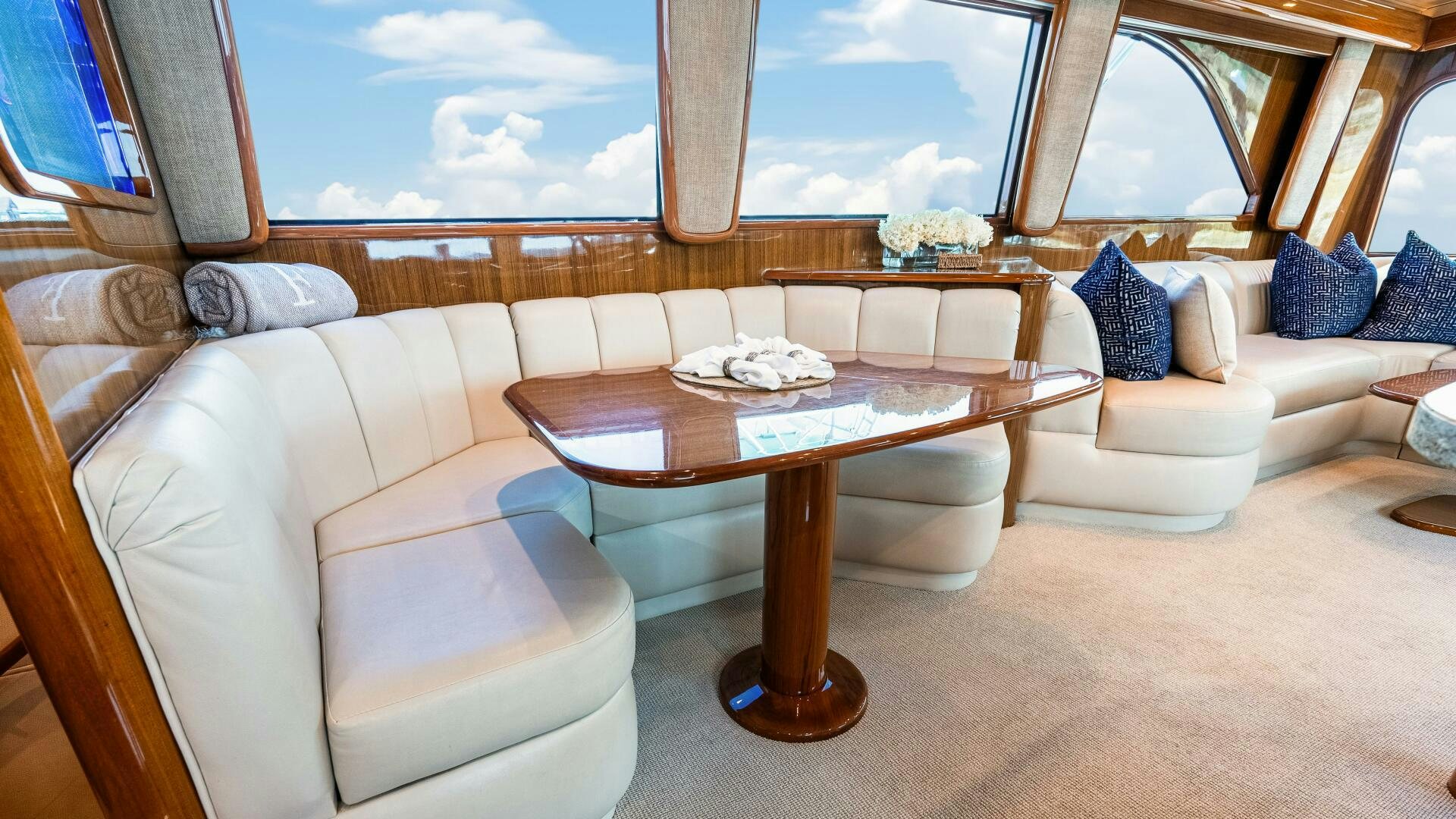 a living room with a couch and a table aboard BLUE EYES Yacht for Sale