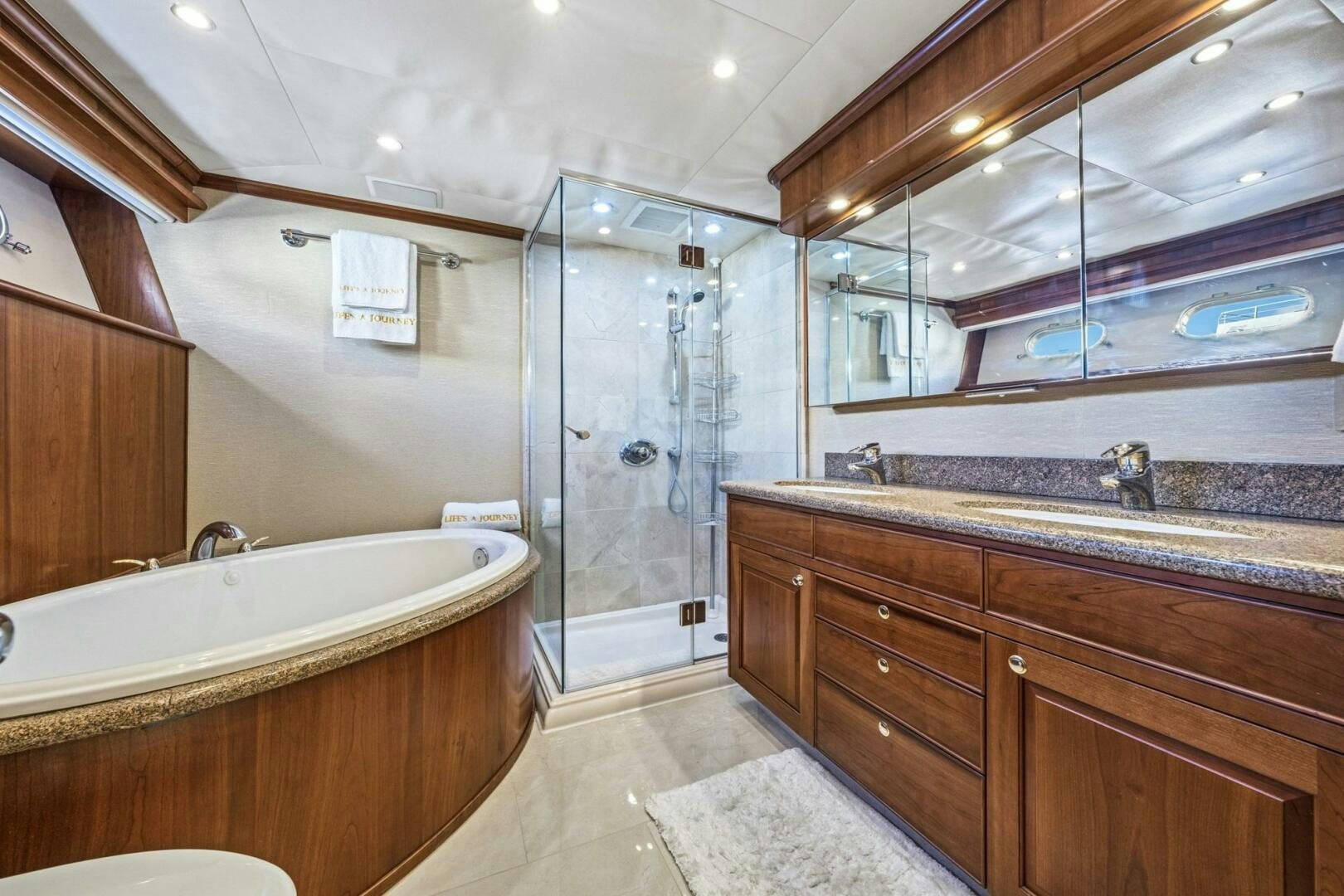 a bathroom with a large mirror aboard LIFE'S A JOURNEY Yacht for Sale