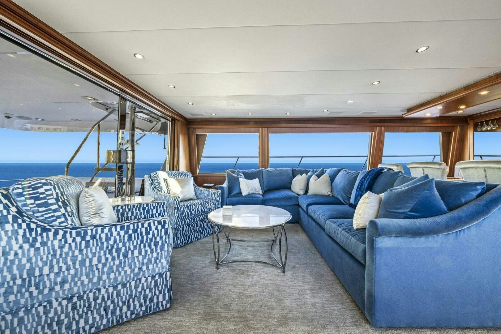 a large blue couch in a boat aboard LIFE'S A JOURNEY Yacht for Sale