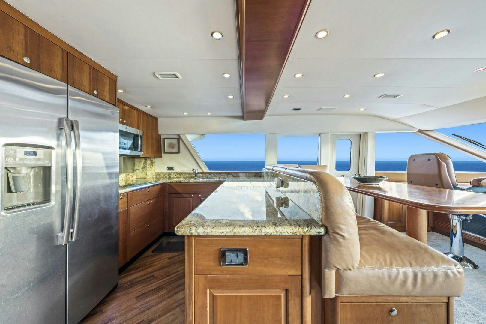a kitchen with a large island aboard LIFE'S A JOURNEY Yacht for Sale