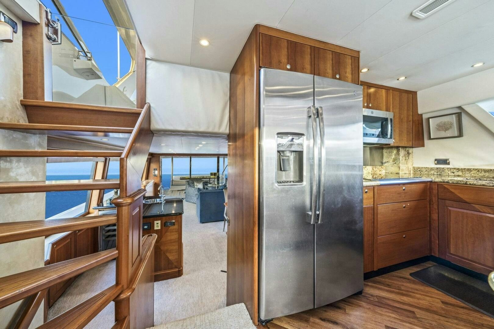 a kitchen with a stainless steel refrigerator aboard LIFE'S A JOURNEY Yacht for Sale