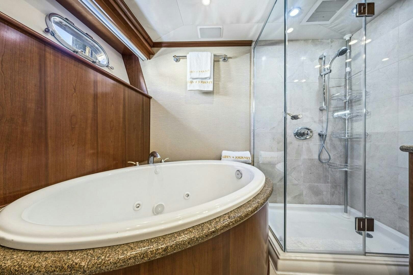 a bathroom with a large bathtub aboard LIFE'S A JOURNEY Yacht for Sale