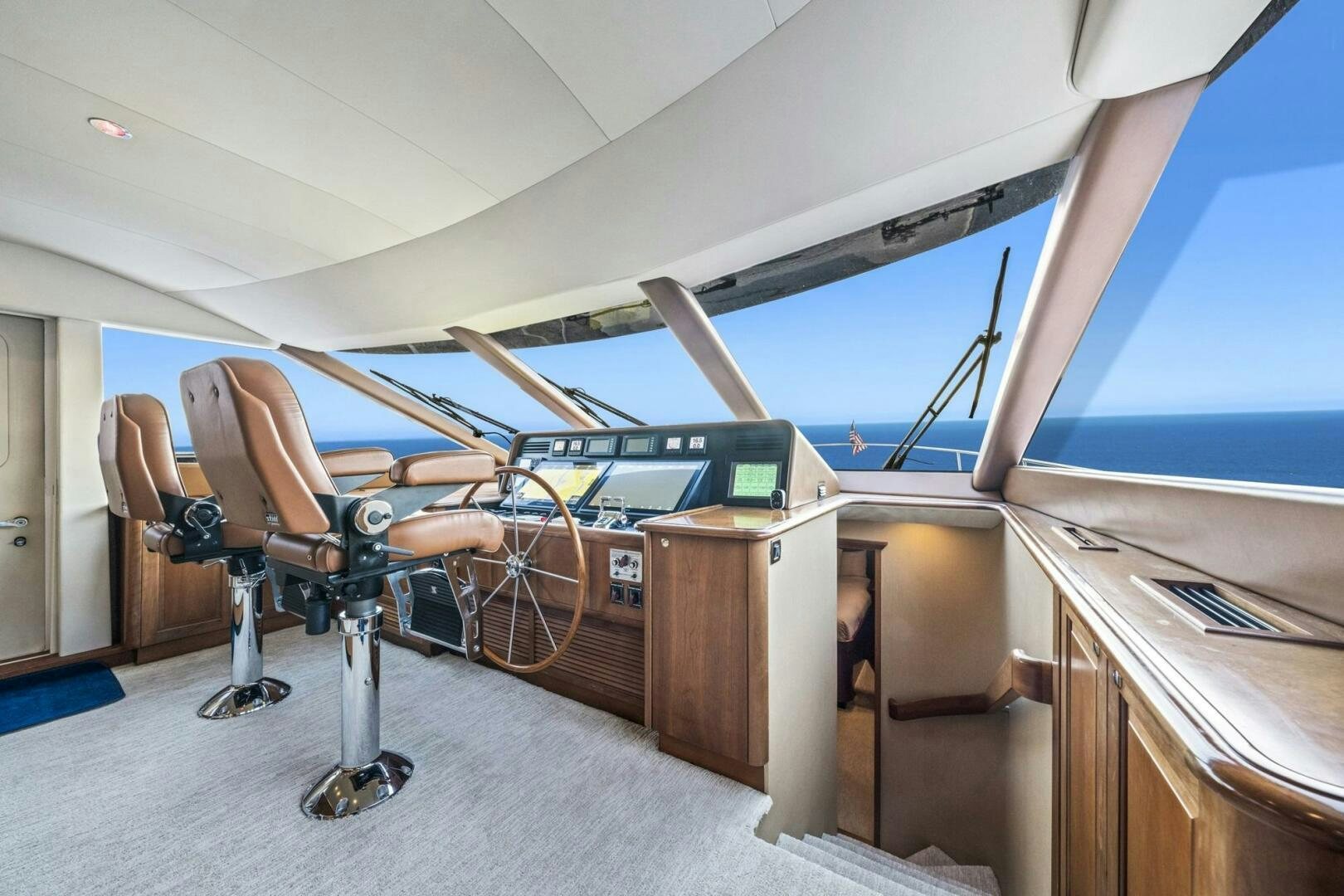 a room with a desk and chairs aboard LIFE'S A JOURNEY Yacht for Sale