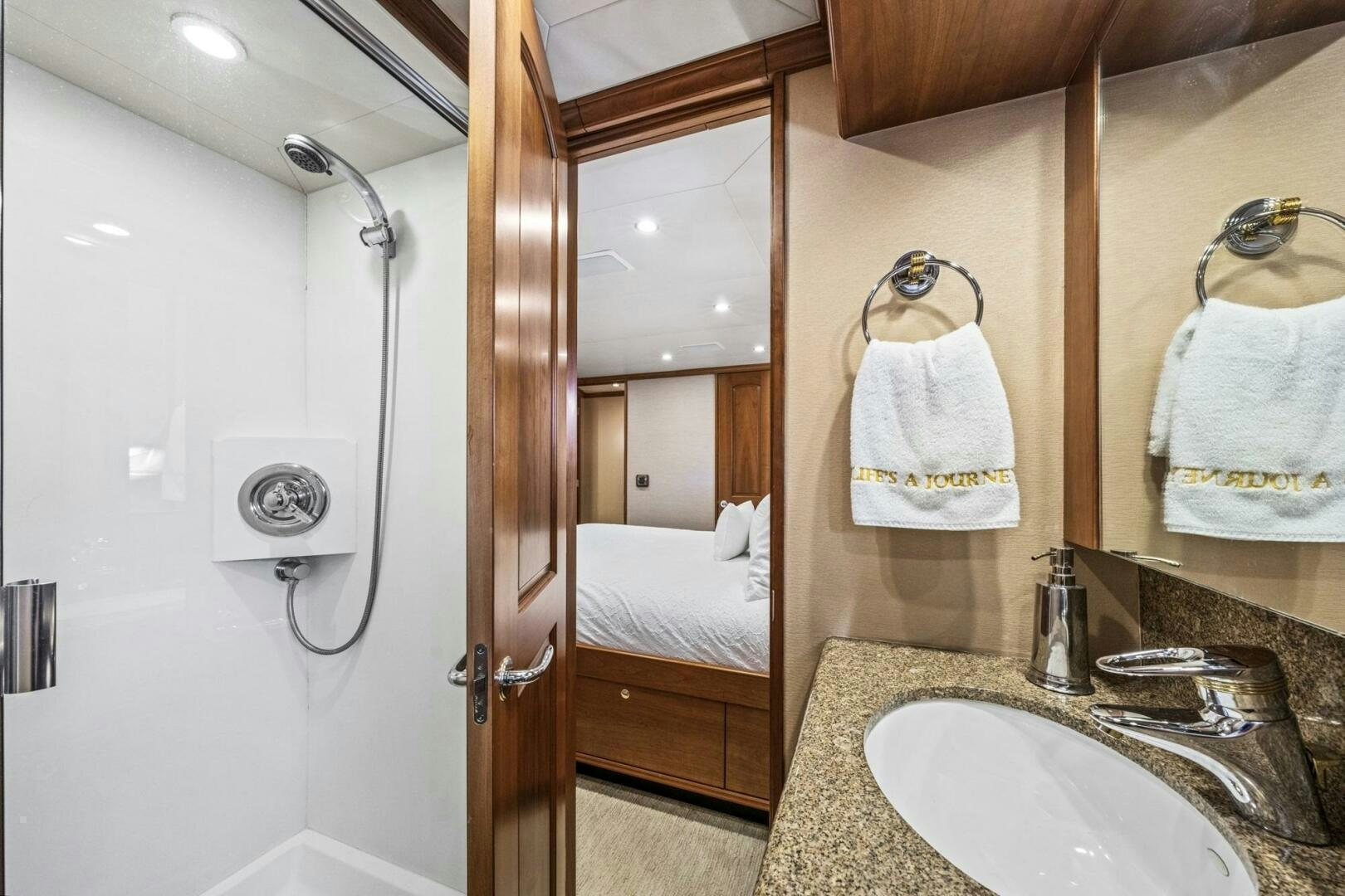 a bathroom with a sink and a shower aboard LIFE'S A JOURNEY Yacht for Sale