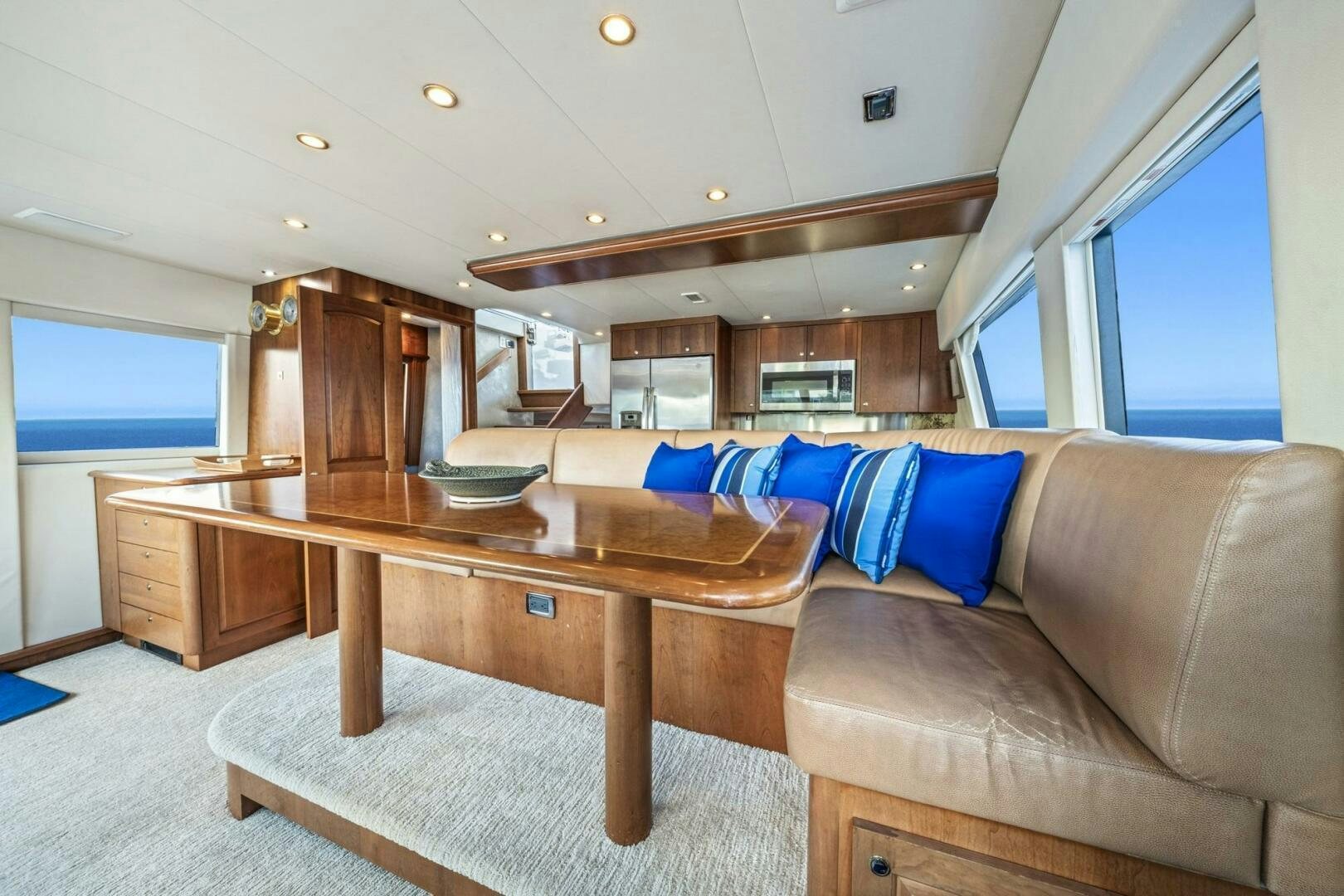 a living room with a couch and a table aboard LIFE'S A JOURNEY Yacht for Sale