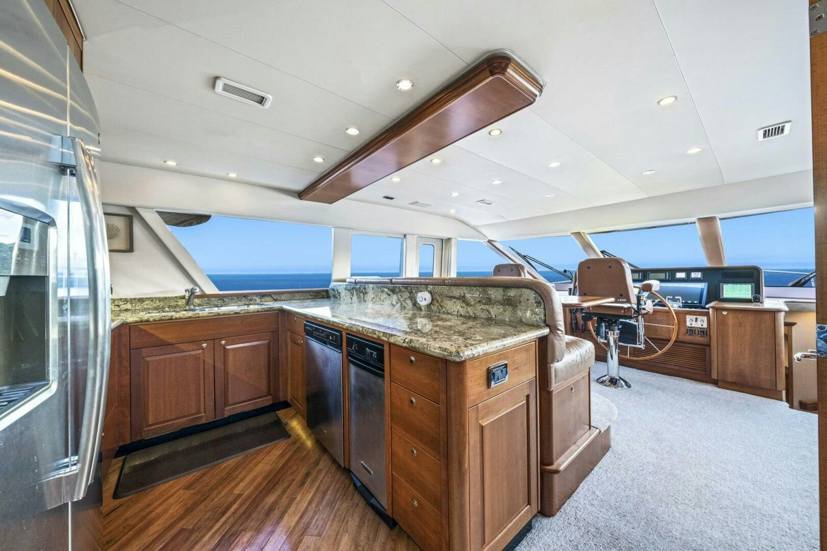 a large kitchen with a large island aboard LIFE'S A JOURNEY Yacht for Sale