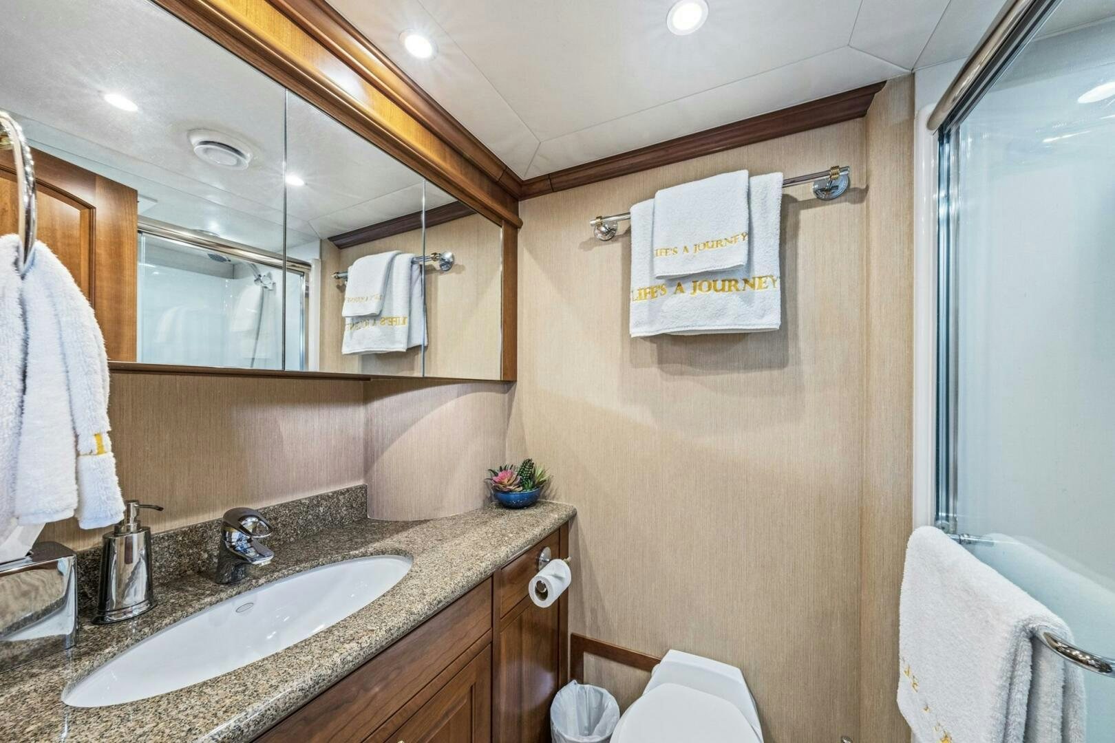 a bathroom with a sink and mirror aboard LIFE'S A JOURNEY Yacht for Sale