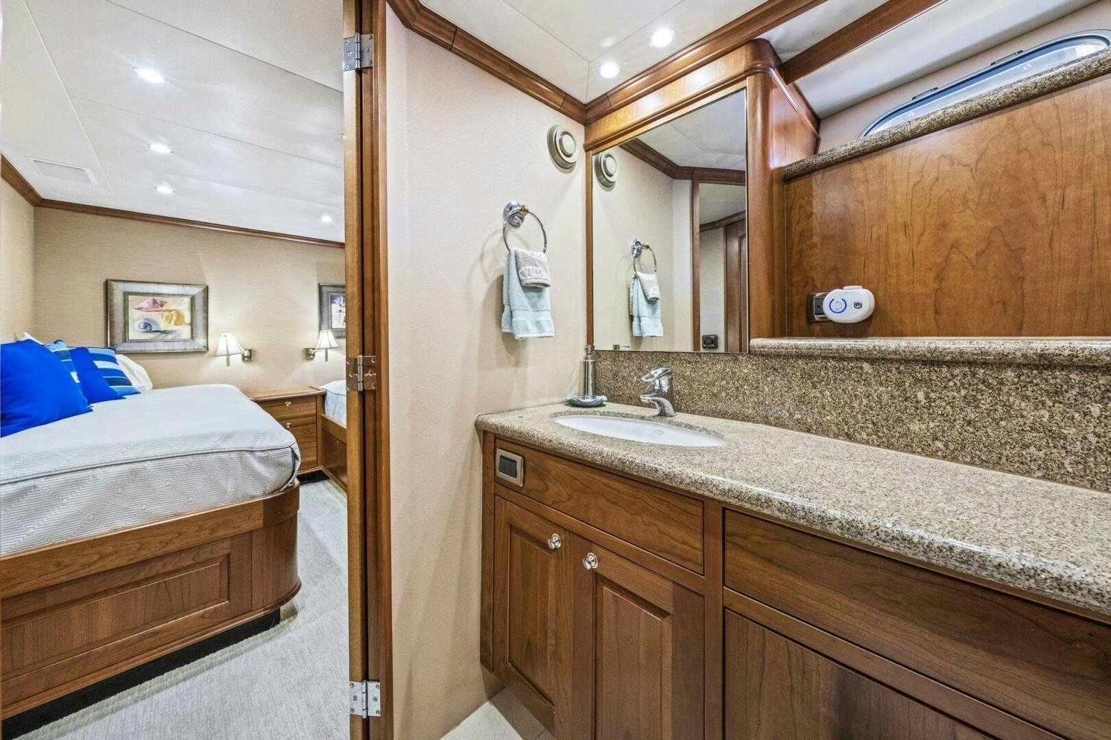 a bathroom with a sink and a bed aboard LIFE'S A JOURNEY Yacht for Sale