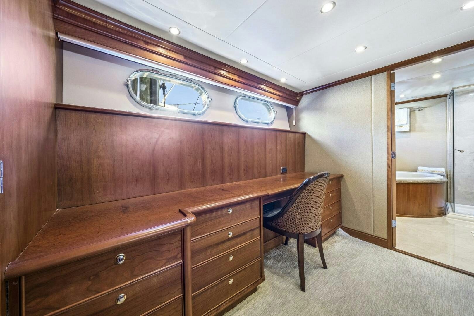 a room with a desk and a chair aboard LIFE'S A JOURNEY Yacht for Sale