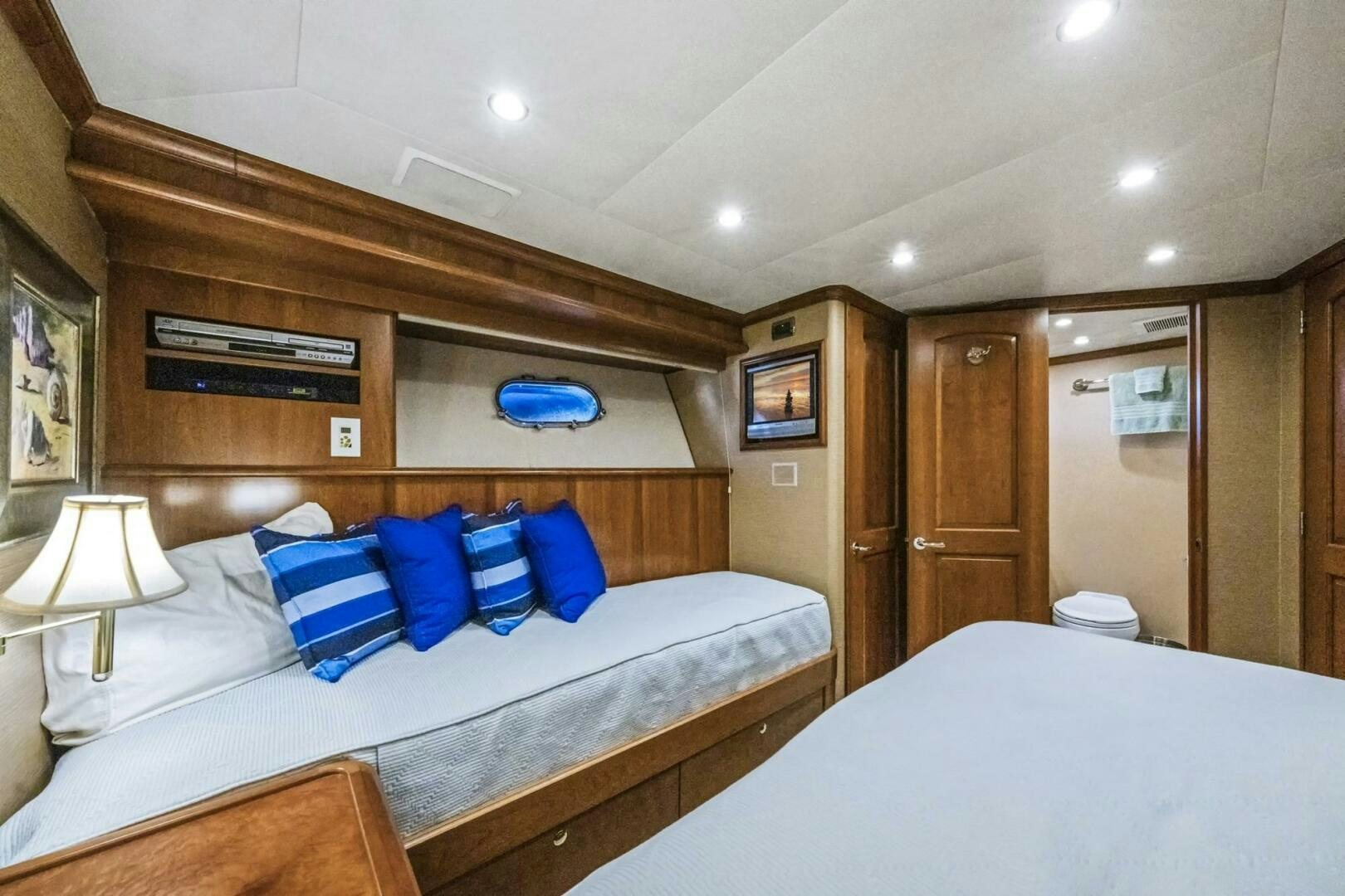 a room with a bed and a wood door aboard LIFE'S A JOURNEY Yacht for Sale