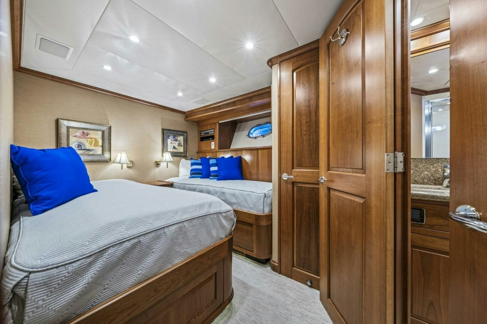 a room with a bed and a closet aboard LIFE'S A JOURNEY Yacht for Sale