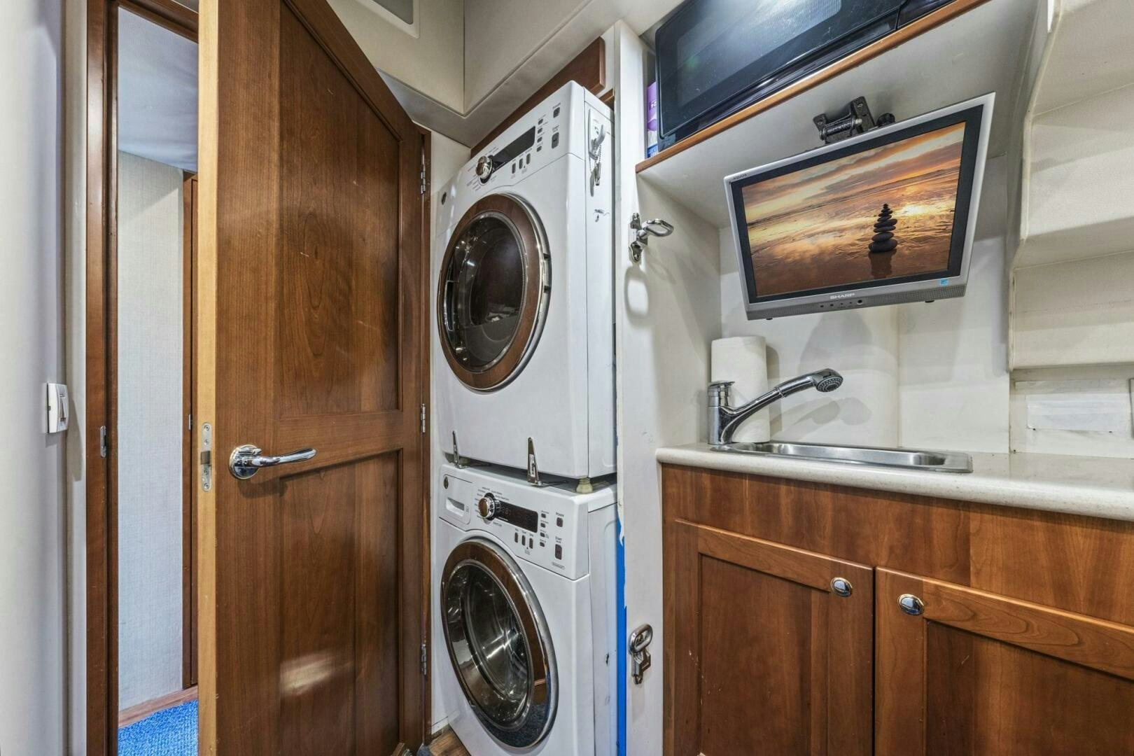 a washer and dryer in a bathroom aboard LIFE'S A JOURNEY Yacht for Sale