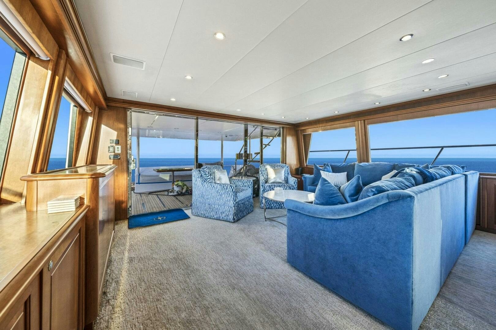 a room with a view of the ocean and the deck aboard LIFE'S A JOURNEY Yacht for Sale