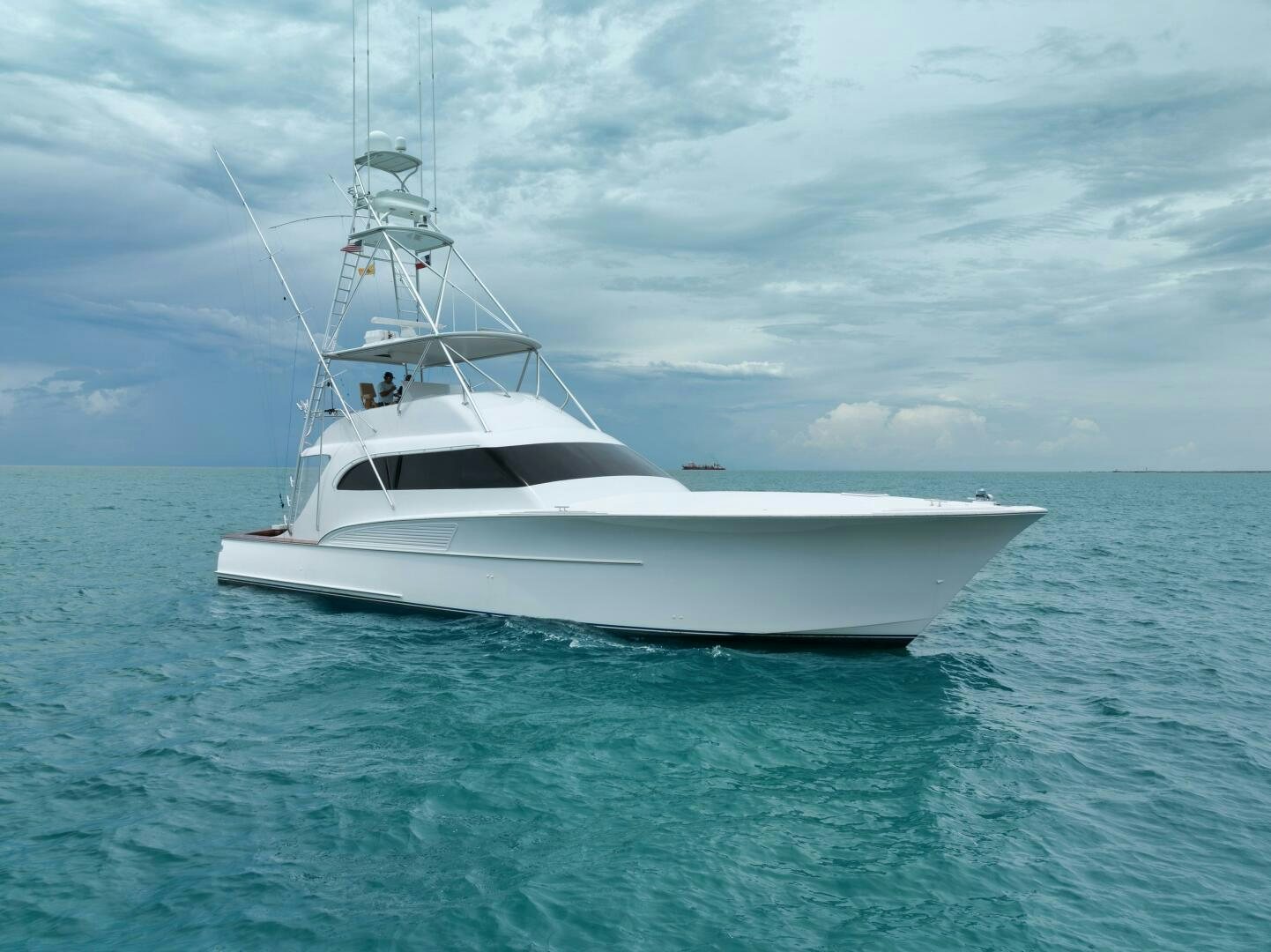 a white boat in the water aboard LET  RIDE Yacht for Sale