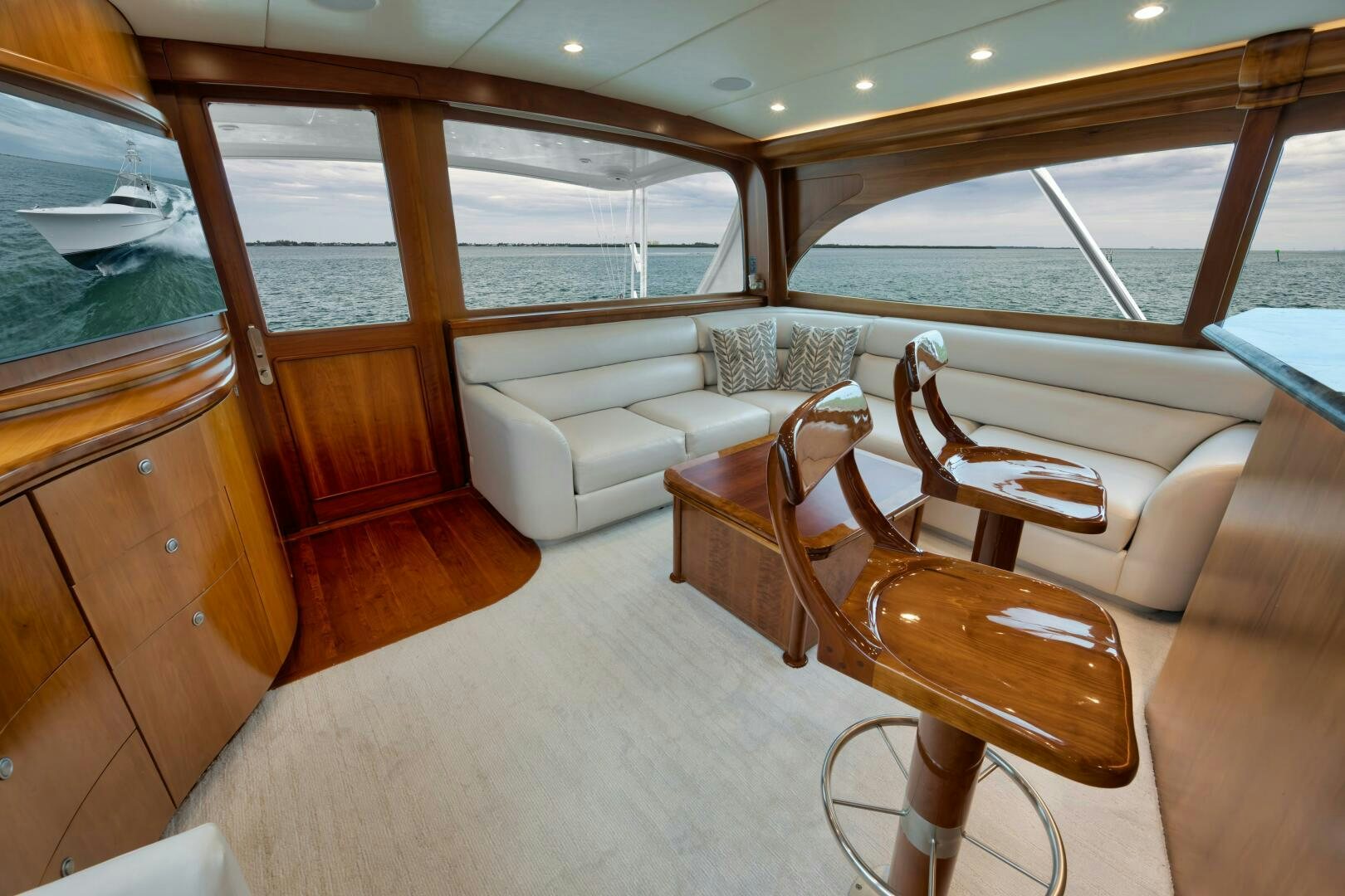 a room with a couch and a table and chairs aboard LET  RIDE Yacht for Sale