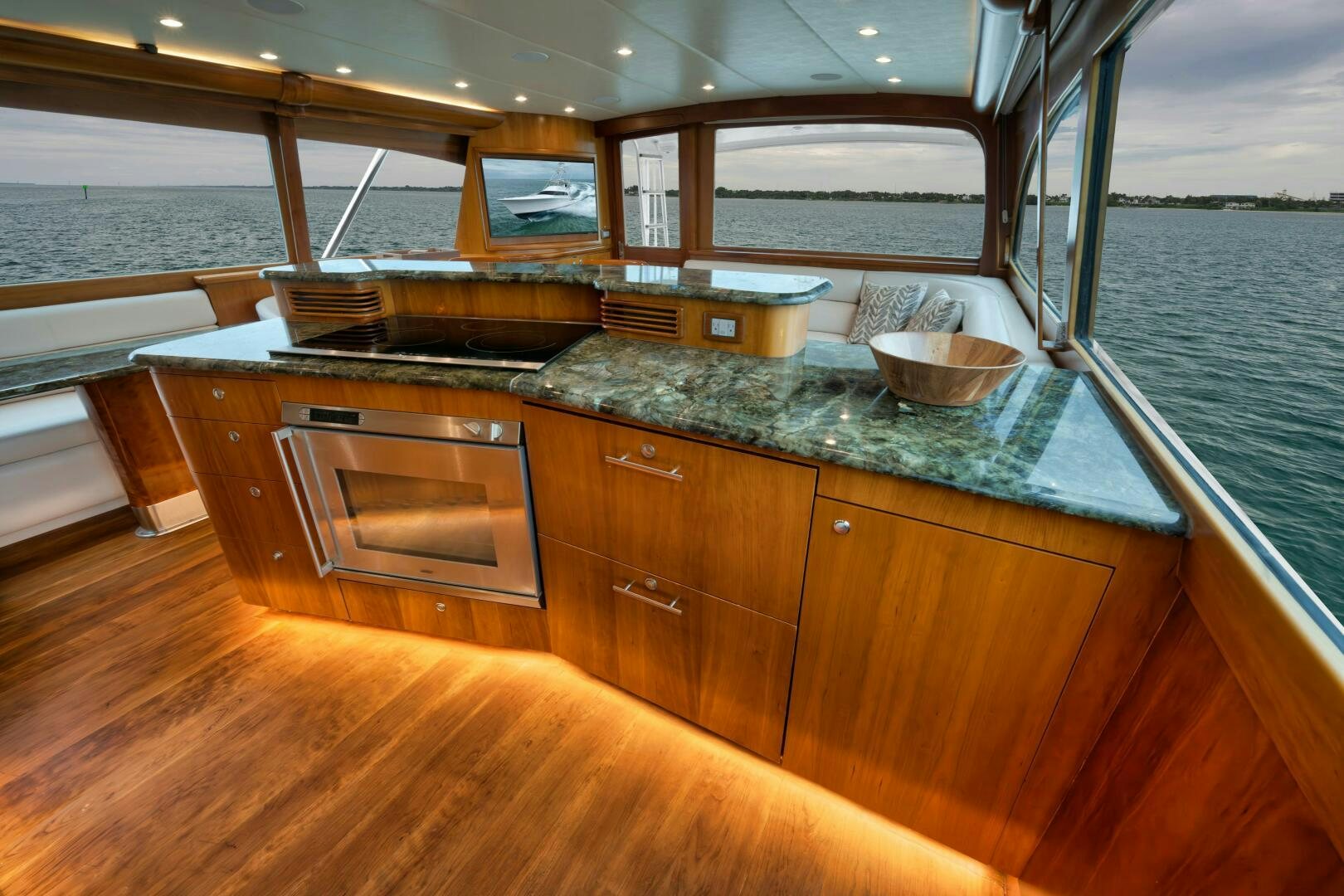 a kitchen with a large island aboard LET  RIDE Yacht for Sale