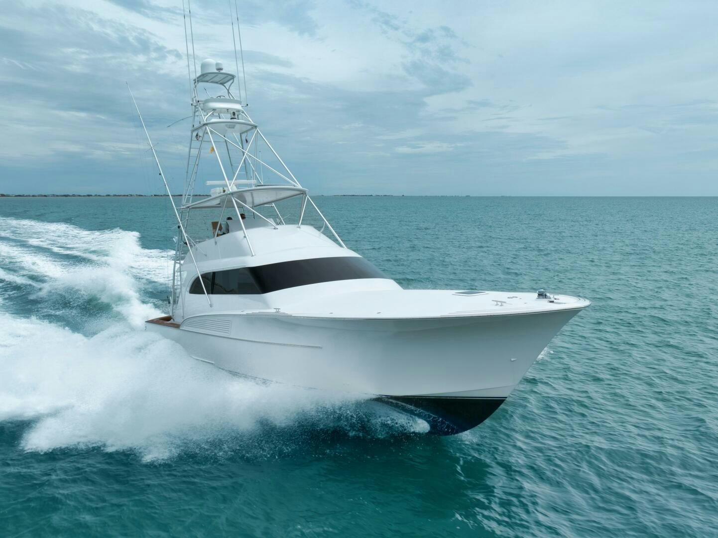 a white boat in the water aboard LET  RIDE Yacht for Sale