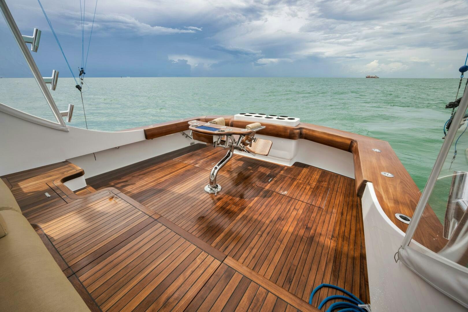 a deck with a view of the ocean and the ocean aboard LET  RIDE Yacht for Sale