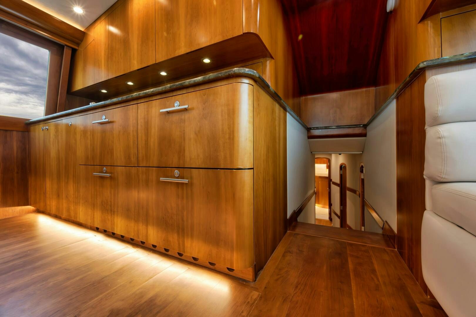 a wooden cabinet in a room aboard LET  RIDE Yacht for Sale