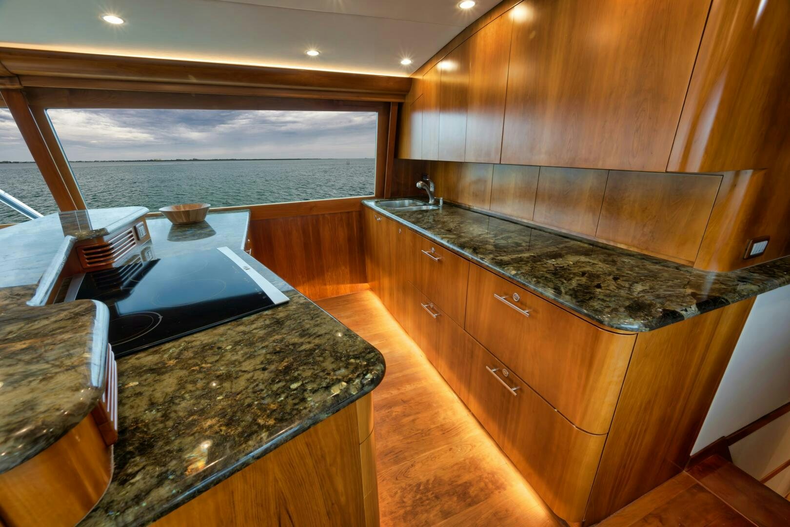 a kitchen with a large island aboard LET  RIDE Yacht for Sale
